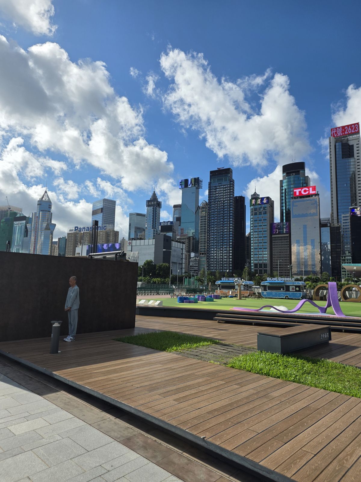 Wanchai waterfront promenade with the Hong Kong skyline behind